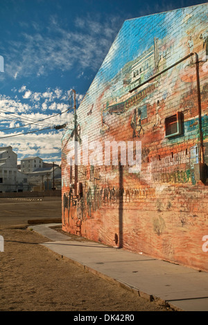 Borax chemical plant and History Mural on building in Trona, California Stock Photo