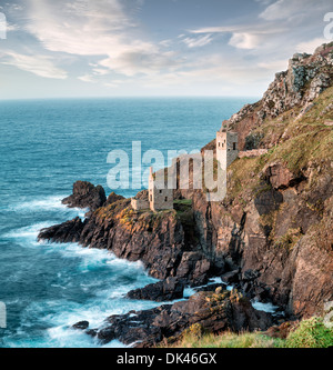 Cornish tin mines perched on the edge of steep cliffs at Botallack near Lands End in Cornwall Stock Photo