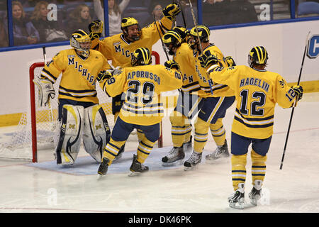 Mar. 25, 2011 - Saint Louis, Missouri, U.S - University of Michigan Wolverines players celebrate their victory during the first round of the NCAA Division I Men's Ice Hockey West Regional Frozen Four Tournament game between the University of Michigan Wolverines and the University of Nebraska at Omaha Mavericks at the Scottrade Center in Saint Louis, Missouri.  Michigan defeated UNO Stock Photo