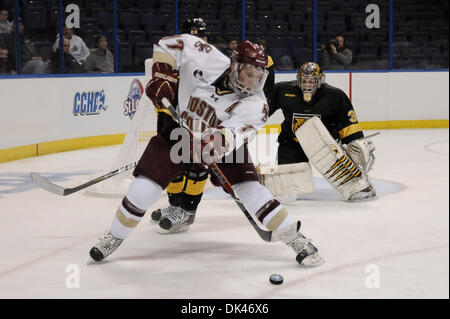 Mar. 25, 2011 - Saint Louis, Missouri, U.S - During the 2011 West Regional playoffs at Scottrade Center in St. Louis, Missouri.  Boston center Brian Gibbons (17) controls the puck in the corner.  Colorado College controlled the game as they defeated Boston College 8 to 4 to advance to the West Regional finals. (Credit Image: © Richard Ulreich/Southcreek Global/ZUMApress.com) Stock Photo