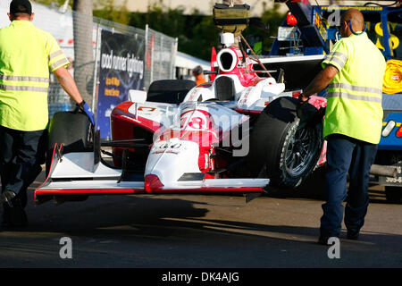 Mar. 27, 2011 - St.Petersburg, Florida, U.S - IZOD IndyCar driver James Jakes of Dale Coyne Racing (18) has his car towed from the track back to the paddock after crashing during IndyCar warm up at the Honda Grand Prix of St. Petersburg. (Credit Image: © Luke Johnson/Southcreek Global/ZUMApress.com) Stock Photo