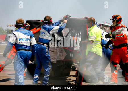 Mar. 27, 2011 - St.Petersburg, Florida, U.S - Rescue crews flip over IZOD IndyCar driver Marco Andretti of Andretti Autosport (26) car after he crashed during the start of the Honda Grand Prix of St. Petersburg. (Credit Image: © Luke Johnson/Southcreek Global/ZUMApress.com) Stock Photo