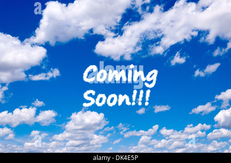 Coming soon sign clouds on the clear blue sky Stock Photo