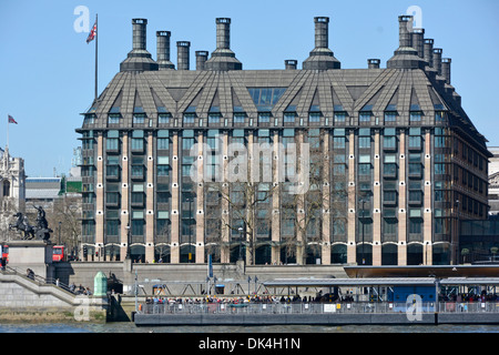 Modern Portcullis house Palace of Westminster MPs office building for UK members of Parliament beside River Thames & Westminster Pier London UK Stock Photo
