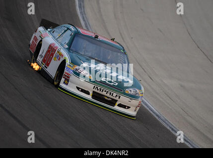 Apr. 9, 2011 - Fort Worth, Texas, U.S - Flames shoot out from under the car of Sprint Cup Series driver Dale Earnhardt Jr. (88) during the Samsung Mobile 500 NASCAR race at Texas Motor Speedway at Fort Worth, Texas. (Credit Image: © Jerome Miron/Southcreek Global/ZUMAPRESS.com) Stock Photo