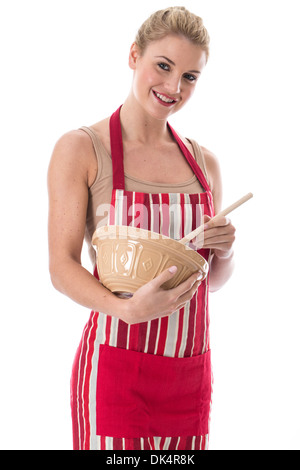 Model Released. Attractive Young Woman Mixing Cooking Ingredients Stock Photo