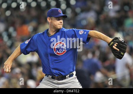 Chicago Cubs pitcher Kerry Wood's son, Justin, comes onto the field to  greet him after his final appearance in the eighth inning against the  Chicago White Sox at Wrigley Field in Chicago