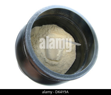 Scoop of vanilla whey isolate protein in a black plastic container on white, top view Stock Photo