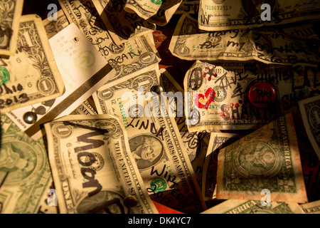 Dollar bills on the wall in Salty Dawg Saloon on The Spit, Homer, Alaska, USA Stock Photo