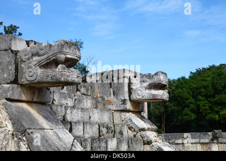 Close up of  stone serpent heads at Chichen Itza Mayan ruins on the Yucatan peninsular Mexico North America Stock Photo