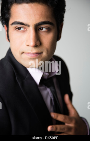 Professional young Indian man looking away Stock Photo