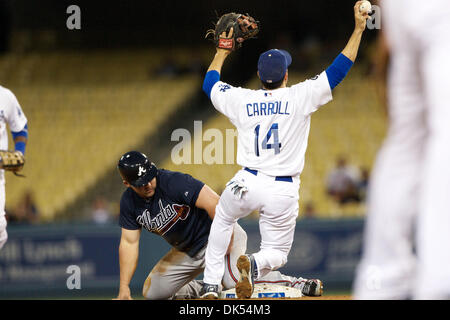 Apr. 20, 2011 - Los Angeles, California, United States of America - Los Angeles Dodgers shortstop Jamey Carroll (14) shows the umpire the ball, after tagging out Atlanta Braves second baseman Dan Uggla (26) for an out, during a game between the Atlanta Braves and the Los Angeles Dodgers. (Credit Image: © Tony Leon/Southcreek Global/ZUMAPRESS.com) Stock Photo