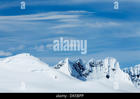 Antarctica, Morning sun shines on snow-covered mountains along Gerlache Strait near Brabant Island along Antarctic Peninsula Stock Photo