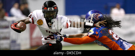 April 29, 2011 - Fairbanks, AK, U.S. - John Wagner/News-Miner.Wenatchee quarterback Charles Dowdell, left, tries to escape the coverage of Fairbanks Grizzlies defensive back Noah Harris during Friday evening's, April 29, 2011, game at the Carlson Center. (Credit Image: © John Wagner/Fairbanks Daily News-Miner/ZUMAPRESS.com) Stock Photo