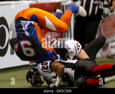 April 29, 2011 - Fairbanks, AK, U.S. - John Wagner/News-Miner.Fairbanks Grizzlies running back Dre Gibbs, upside down, maintains possession of the ball after running for yardage and being upended by Wenatchee running back Cortes Rice during Friday evening's, April 29, 2011, game at the Carlson Center. (Credit Image: © John Wagner/Fairbanks Daily News-Miner/ZUMAPRESS.com) Stock Photo