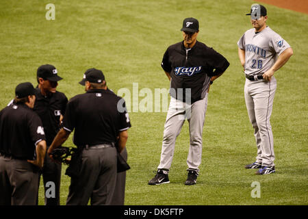 May 4, 2011 - St.Petersburg, Florida, U.S - Toronto Blue Jays manager John Farrell (52) and Toronto Blue Jays first baseman Adam Lind (26) observe as umpires discuss a call at first during the match up between the Tampa Bay Rays and the Toronto Blue Jays at Tropicana Field. The Blue Jays lead 3-1 (Credit Image: © Luke Johnson/Southcreek Global/ZUMApress.com) Stock Photo