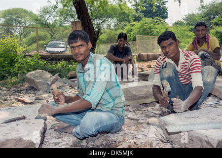 Stone workers preparing floor slabs, Pavagadh Hill Road, Champaner-Pavagadh Archaeological Park, Gujurat State, India Stock Photo