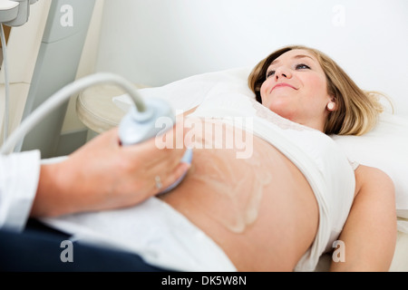 Woman Going Through An Ultrasound Scan Stock Photo