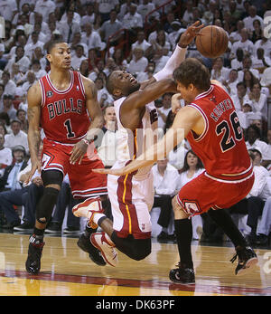 May 22, 2011 - West Palm Beach, Florida, U.S. -  MIAMI - AMERICAN AIRLINES ARENA - BULLS VS HEAT - R3G3 - The Heat's Dwyane Wade is fouled by Kyle Korver of the Bulls on a drive during a playoff game Sunday night at American Airlines Arena. Derrick Rose of the Bulls watches from behind. (Credit Image: © Damon Higgins/The Palm Beach Post/ZUMAPRESS.com) Stock Photo