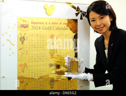 (131203) -- TOKYO, Dec. 3, 2013 (Xinhua) -- A Japan's jewelry shop Ginza Tanaka's employee introduces 'Disney Pure Gold Big Calender' in Tokyo, Japan, Dec. 3, 2013. 'Disney Pure Gold Big Calender' is made of 54 puzzle pieces (10 kilogram pure gold). Ginza Tanaka sells at a price of 100,000,000 JPY(around 1,013,880 US dollars). (Xinhua) Stock Photo