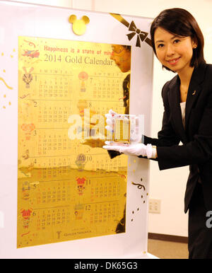 (131203) -- TOKYO, Dec. 3, 2013 (Xinhua) -- A Japan's jewelry shop Ginza Tanaka's employee introduces 'Disney Pure Gold Big Calender' in Tokyo, Japan, Dec. 3, 2013. 'Disney Pure Gold Big Calender' is made of 54 puzzle pieces (10 kilogram pure gold). Ginza Tanaka sells at a price of 100,000,000 JPY(around 1,013,880 US dollars).  (Xinhua) Stock Photo