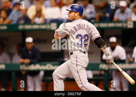 Texas Rangers' Josh Hamilton, left, and Esteban German rejoice after  Hamilton scored in the fifth inning against the St. Louis Cardinals in Game  6 of the World Series at Busch Stadium in