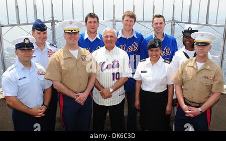 June 1, 2011 - Manhattan, New York, U.S. - From left: US Coast Guard MST1 Carlos Sivilla, Air Force Captain Bryan Bouchard, US Marine Captain Cameron Wilson, Mets catcher Josh Thole, Mets Manager Terry Collins, Mets outfielder Jason Bay, US Army Master Sgt. Betty Thompson, Mets infielder David Wright, US US Navy OS2 Candice Williams and Marine Major Dan Mesweeny. New York Mets play Stock Photo