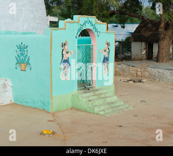 Rural Indian village hindu temple painting of an Indian woman / Gopi offering flowers. Andhra Pradesh, India Stock Photo