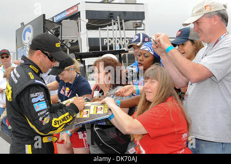 June 11, 2011 - Long Pond, Pennsylvania, United States of America - Marcos  Ambrose signs autographs for the fans after his qualifying run for the 5-Hour Energy 500 at the Pocono Raceway. (Credit Image: © Brian Freed/Southcreek Global/ZUMAPRESS.com) Stock Photo