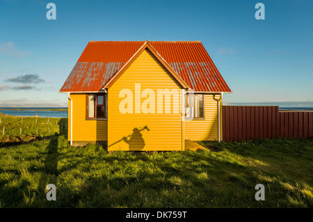 Shadow of photographer with tripod on Summer house, Flatey Island, Breidafjordur, Iceland Stock Photo