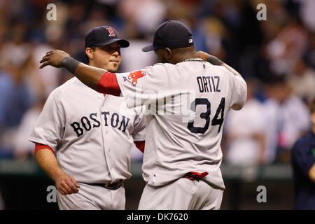 Boston Red Sox catcher Jason Varitek slaps the helmet of designated hitter  David Ortiz after Ortiz hit his 50th home run of the season off Minnesota  Twins pitcher Boof Bonser during the