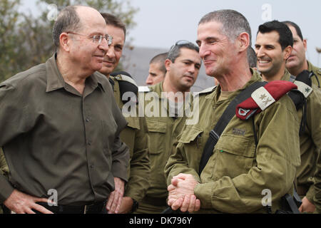 Golan Heights, Israel. 3rd Dec 2013.  Israeli Defense Minister Moshe Ya'alon (1st L) smiles during an inspection of the Israeli Defense Forces (IDF) military base at the Golan Heights, on Dec. 3, 2013. Israeli Defense Minister Moshe Ya'alon said Tuesday that Israel provides humanitarian assistance to Syrian citizens in villages near the border with the Jewish state, local media reported. Credit:  Xinhua/Alamy Live News Stock Photo