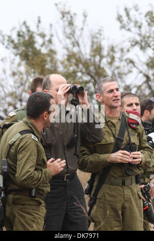 Golan Heights, Israel. 3rd Dec 2013.  Israeli Defense Minister Moshe Ya'alon (2nd L, Front) inspects the Israeli Defense Forces (IDF) military base at the Golan Heights, on Dec. 3, 2013. Israeli Defense Minister Moshe Ya'alon said Tuesday that Israel provides humanitarian assistance to Syrian citizens in villages near the border with the Jewish state, local media reported. Credit:  Xinhua/Alamy Live News Stock Photo