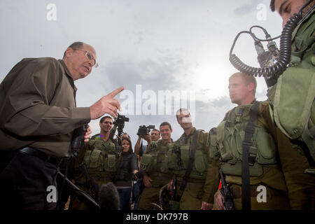 Golan Heights, Israel. 3rd Dec 2013.  Israeli Defense Minister Moshe Ya'alon (1st L) inspects the Israeli Defense Forces (IDF) military base at the Golan Heights, on Dec. 3, 2013. Israeli Defense Minister Moshe Ya'alon said Tuesday that Israel provides humanitarian assistance to Syrian citizens in villages near the border with the Jewish state, local media reported. Credit:  Xinhua/Alamy Live News Stock Photo