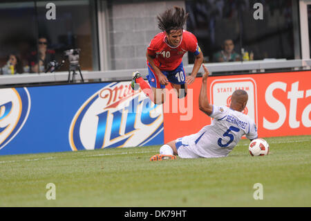 June 18, 2011 - East Rutherford, New Jersey, U.S - Costa Rican forward Bryan Ruiz (10) is tripped by Honrudan defender Victor Bernardez (5) during first half CONCACAF Gold Cup action between Costa Rica and Honduras at the New Meadowlands Stadium in East Rutherford, N.J. (Credit Image: © Will Schneekloth/Southcreek Global/ZUMAPRESS.com) Stock Photo