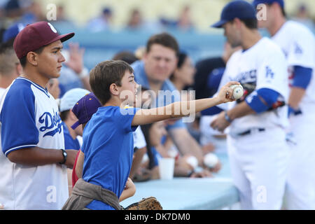 June 21, 2011 - Los Angeles, California, United States of America - A young fan extends his baseball out for players to autograph prior to the start of an inter-league game between the, Detroit Tigers  and the Los Angeles Dodgers at Dodger Stadium. (Credit Image: © Tony Leon/Southcreek Global/ZUMAPRESS.com) Stock Photo