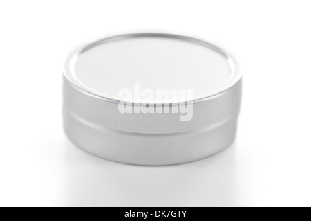 Small size metallic tin made with brushed aluminium on white background. Stock Photo