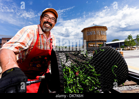 Santa Fe, New Mexico, United States.Farmer Matt Romero roasts fresh green chiles. Stock Photo