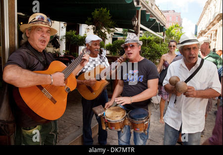 Street musicians Cuba; Cuba music - Musical group playing music in the street, Havana Cuba Caribbean, Latin America Stock Photo