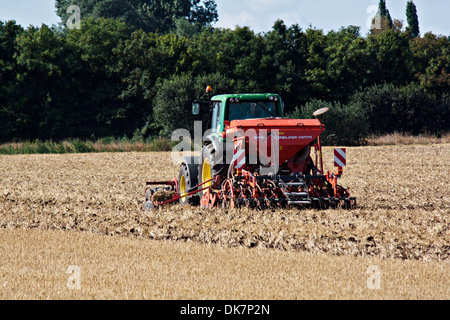 John Deere tractor harrowing Fenland field Stock Photo - Alamy