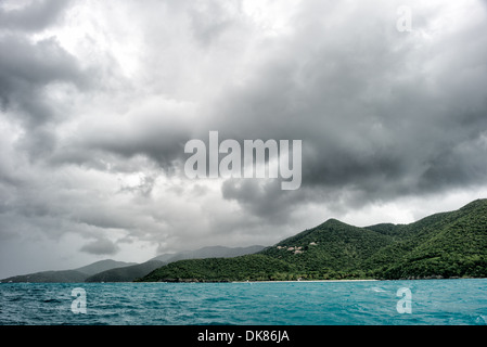 ST JOHN, US Virgin Islands - Storm clouds build over Trunk Bay on St John in the US Virgin Islands. Known for its diverse marine life and coral reefs, the Caribbean region boasts some of the world's most beautiful and well-preserved beachscapes. Stock Photo
