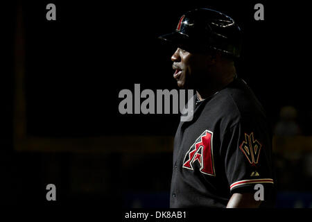 Arizona Diamondbacks first base coach Eric Young says hello to fans in the  stands before a game against the St. Louis Cardinals at Busch Stadium in  St. Louis on August 16, 2012.