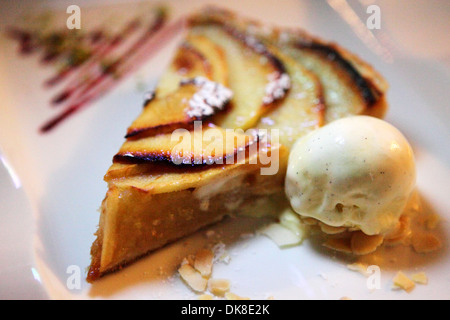 Apple pie served with vanilla ice cream. Stock Photo