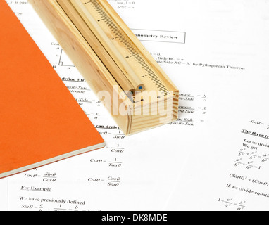 An image showing a book and a wooden pencil case with some pencils Stock Photo