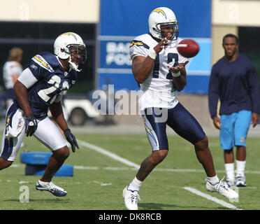 Patriots RB Corey Dillon blocks a tackle by Chargers CB Quentin Jammer  during their game at Gillette Stadium on Sunday, October 2, 2005. The  Chargers beat the Patriots 41-17, ending the Patriots'