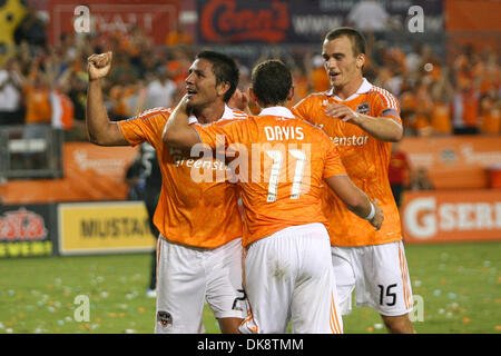 July 30, 2011 - Houston, Texas, U.S - Houston Dynamo Forward Brian Ching (25) gets congratulated by teammates Houston Dynamo Midfielder Brad Davis (11) and Houston Dynamo Forward Cam Weaver (15). Houston Dynamo defeated the Seattle Sounders FC 3-1 at Robertson Stadium in Houston, Texas. (Credit Image: © Luis Leyva/Southcreek Global/ZUMAPRESS.com) Stock Photo