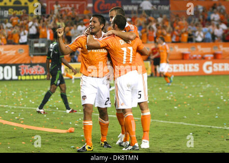 July 30, 2011 - Houston, Texas, U.S - Houston Dynamo Forward Brian Ching (25) gets congratulated by teammates Houston Dynamo Midfielder Brad Davis (11) and Houston Dynamo Forward Cam Weaver (15). Houston Dynamo defeated the Seattle Sounders FC 3-1 at Robertson Stadium in Houston, Texas. (Credit Image: © Luis Leyva/Southcreek Global/ZUMAPRESS.com) Stock Photo