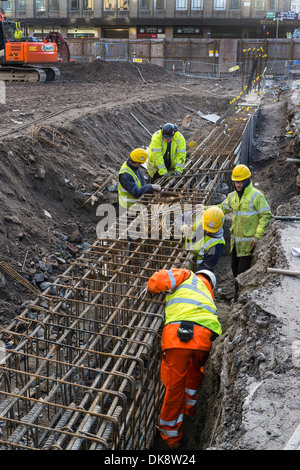 Workmen preparing the structure for concrete building foundations, Glasgow, Scotland, UK Stock Photo