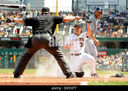 Aug. 7, 2011 - Pittsburgh, PENNSYLVANNIA, U.S - Pittsburgh Pirates relief pitcher Daniel McCutchen (34) looks up at home plate umpire Brian Runge for the call who rules San Diego Padres left fielder Kyle Blanks (88) safe during the sixth inning as the Pittsburgh Pirates take on the San Diego Padres at PNC Park in Pittsburgh, PA....The Padres defeat the Pirates 7-3. (Credit Image: © Stock Photo