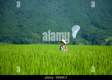 Japanese kid in the countryside Stock Photo